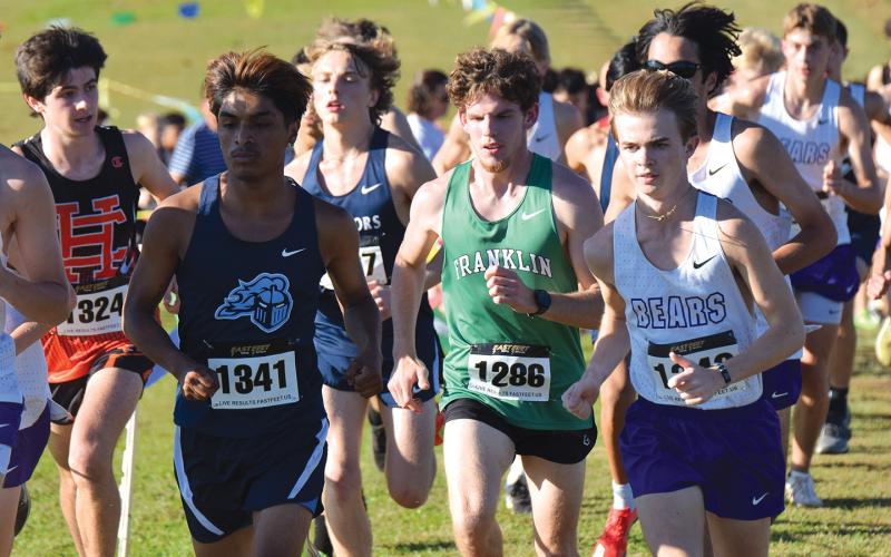Lion Will Gipson was caught in the field to start Thursday’s race in the Jan Taylor Invitational, but eventually found his way to the front and a victory in the race. (Photos by Shane Scoggins)