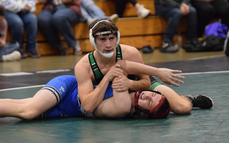 Lion Jacob Henkel works to pin a Banks County opponent during action Tuesday at the wrestling gym in Carnesville. (Photo by Shane Scoggins)