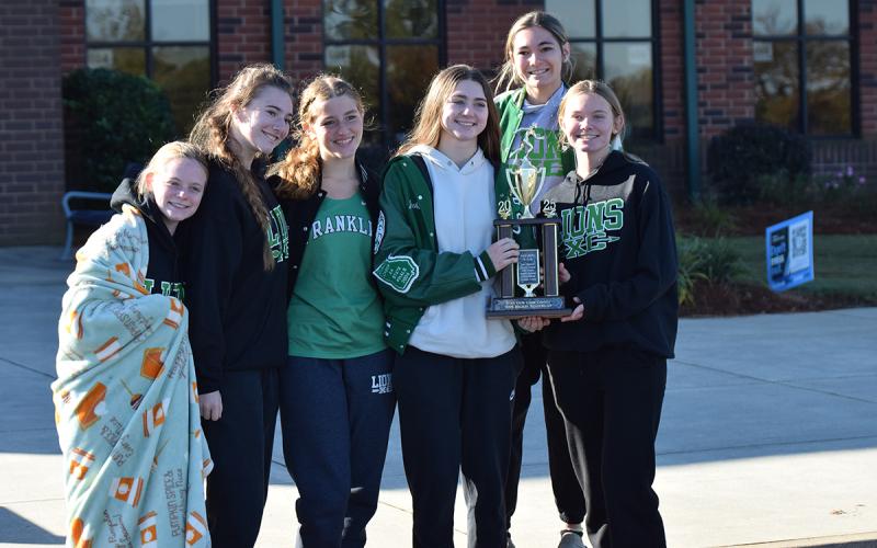 Competing for the region second-place Lady Lions were (right photo, from left) Ella Hodges, Mia Patterson, Reese Cooling, Savannah Jackson, Myla Stratton and Megan Hightower. (Photos by Shane Scoggins)
