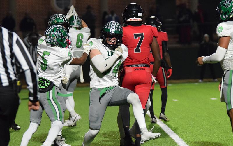 Senior Ramsey Fulbright celebrates after knocking a Callaway blocker into a ballcarrier to cause a safety during Friday’s first round playoff game in LaGrange.