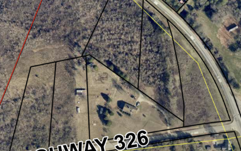 Commissioners approved an appeal of the denial of building permits for four parcels of property on Highway 326 and Sandy Cross Road after a lengthy debate last week.