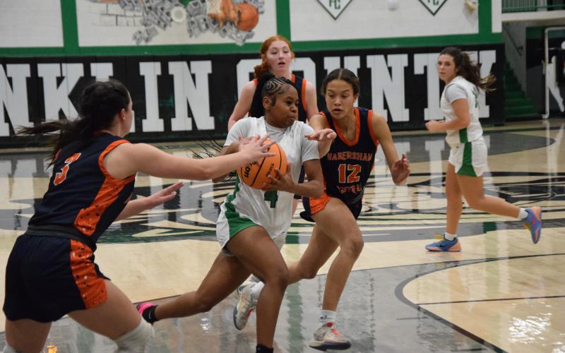 Lady Lion Nykhia Johnson drives toward the basket in action last week against Habersham Central in the Lion’s Den. Johnson finished with eight points. (Photo by Shane Scoggins)