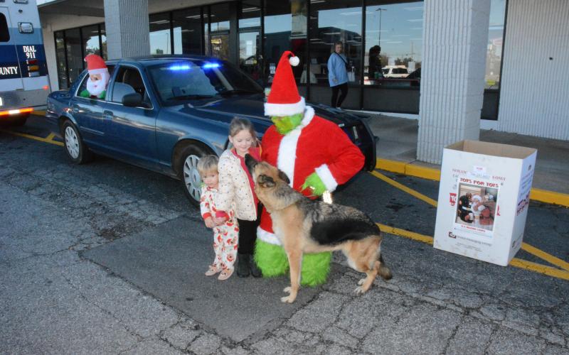 The Grinch and Franklin Springs Police Department K-9 Honor were out Monday collecting Toys for Tots at the Food Lion Shopping Center. Sammy and McKenzie Rafferty came over to say “hi”.