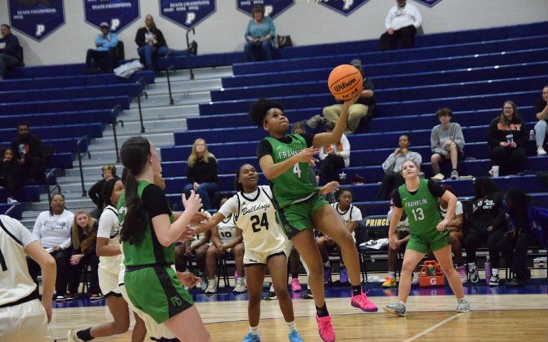 Nykhia Johnson goes up for a layup in the Region 8AA semifinal against Hart County Wednesday at Prince Avenue in Bogart.