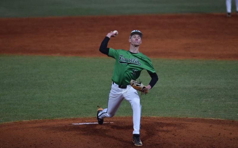 Senior Caden Cawthon delivers a pitch in Franklin County’s season-opening 11-1 win over Washington-Wilkes Monday in Carnesville. (Photo by Shane Scoggins)