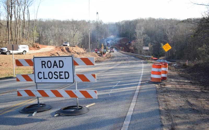 Georgia Highway 106 was closed Tuesday at the Madison County line to replace the bridge over the Hudson River.