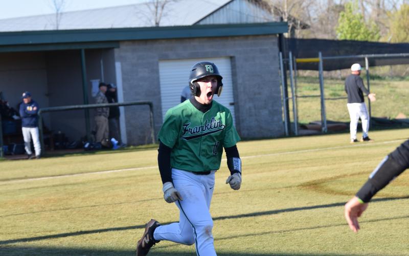 Easton Gailey celebrates after his third home run in the past two games in a contest against Prince Avenue Tuesday in Carnesville. (Photos by Shane Scoggins)