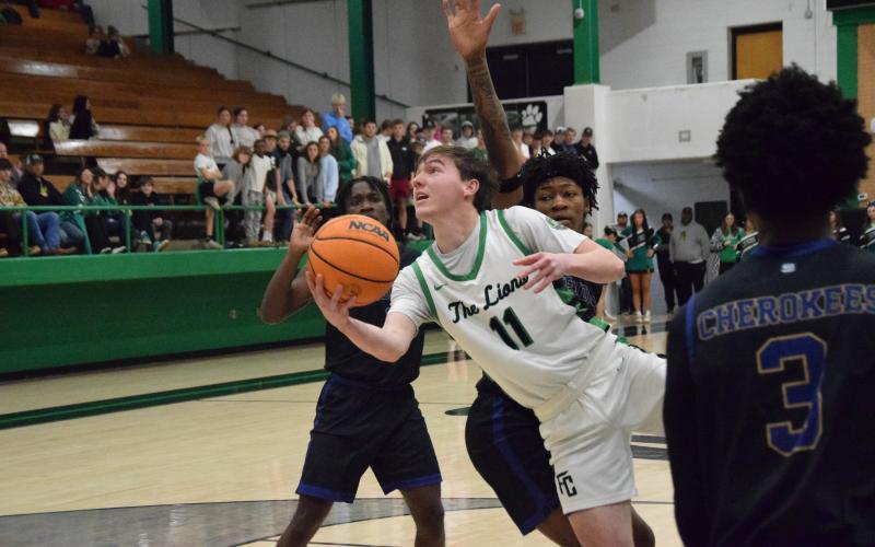 Senior Bentley Huff puts up a shot in Franklin County’s round one win over Kendrick last week in the Lions Den. (Photo by Shane Scoggins)