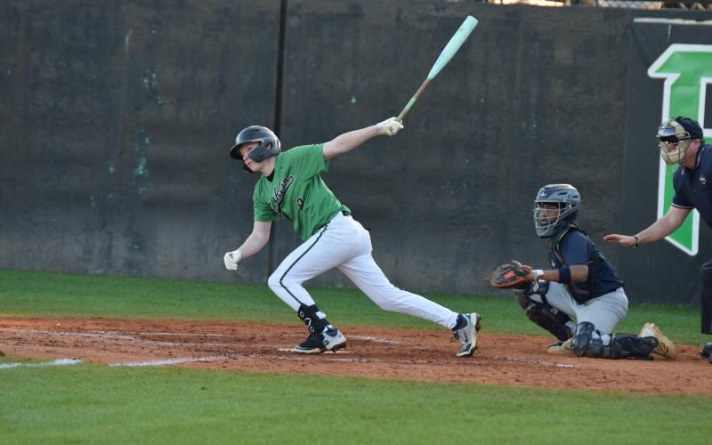 Hudson Huff follows through after one of his three hits – including a leadoff home run – Monday in a Franklin County Lion win over No. 5-ranked Redan in Carnesville. (Photo by Shane Scoggins)