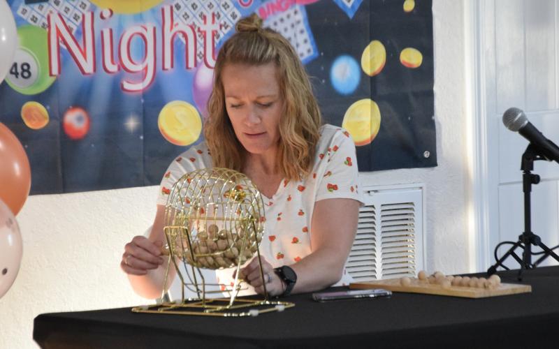 Royston MainStreet Manager Kelly King calls out a number during a dry run of the City of Royston’s new Bingo game that will begin April 2 at the Depot. (Photo by Shane Scoggins)