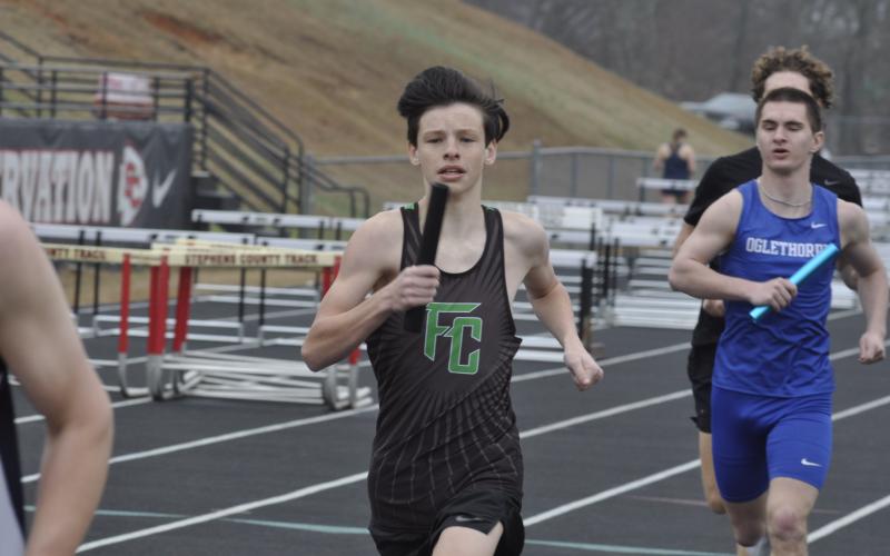 Blane Dodson runs a relay leg at the Currahee Relays Saturday in Toccoa. (Photo courtesy of The Toccoa Record)