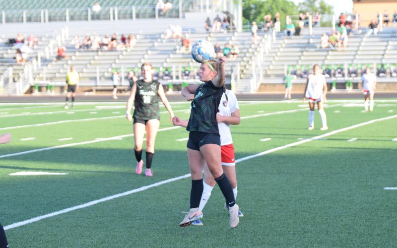 Lady Lion Caleigh Swaney heads the ball in a match against Winder-Barrow Tuesday at FCHS.
