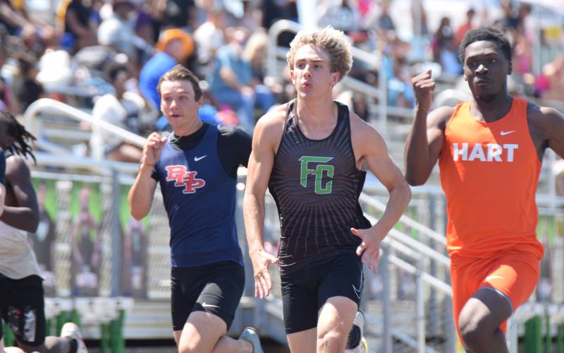 Carson Cheek competes in the 100 meter dash at Saturday's John Scott Hartness Invitational at FCHS. The Lions won first place in the meet over a field of 13 other competitors.