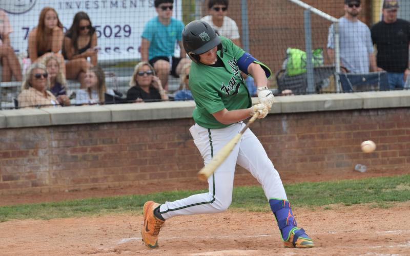 Hudson Huff swings at a pitch during the Lions' first round baseball playoff game against Union County in Blairsville.