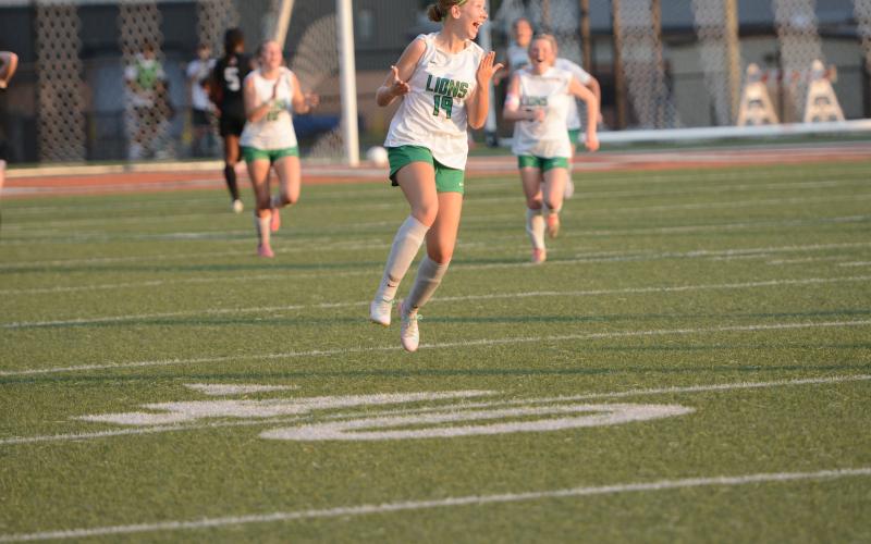 Mckenna Roberts (left photo) celebrates after her goal Friday against the Hart County Lady Bulldogs in Hartwell.
