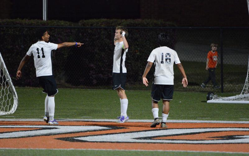 Eli Cooling celebrates with teammate Michael Mejia (right photo) after one of his three goals vs. the Bulldogs Friday, also in Hartwell. The Lions and Lady Lions swept Hart in Region 8AA matches. (Photos courtesy of Benjamin London of The Hartwell Sun)