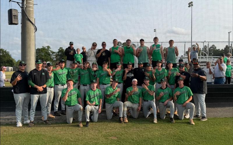 The Franklin County Lions celebrate after winning a three-game series at Appling County last week in Baxley. The win advanced Franklin to the state semifinals for the second year in a row. (Photo courtesy of the Franklin County Lions Baseball Facebook page)
