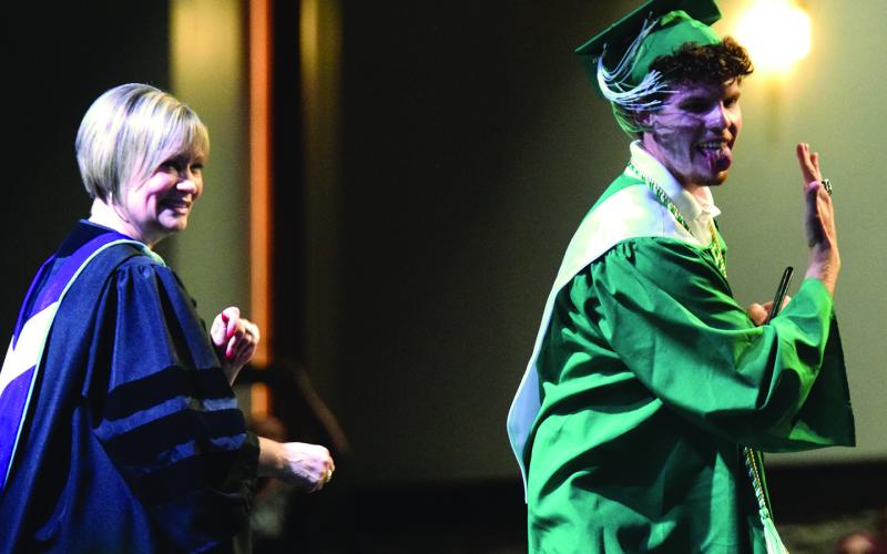 The Franklin County High School Class of 2026 – including Will Gipson (above after receiving his diploma from Superintendent Melanie Burton-Brown)  – happily received their diplomas Friday even after the commencement ceremony was forced into The Swails Center at Emmanuel University by bad weather. For more photos from the annual FCHS graduation, see Pages 6A-7A. (Photos by Shane Scoggins)