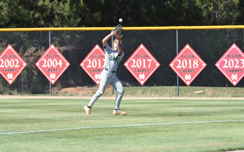 Gavin Holman makes a catch in rightfield during a state semifinal game at Morgan County Thursday. (Photo by Shane Scoggins)