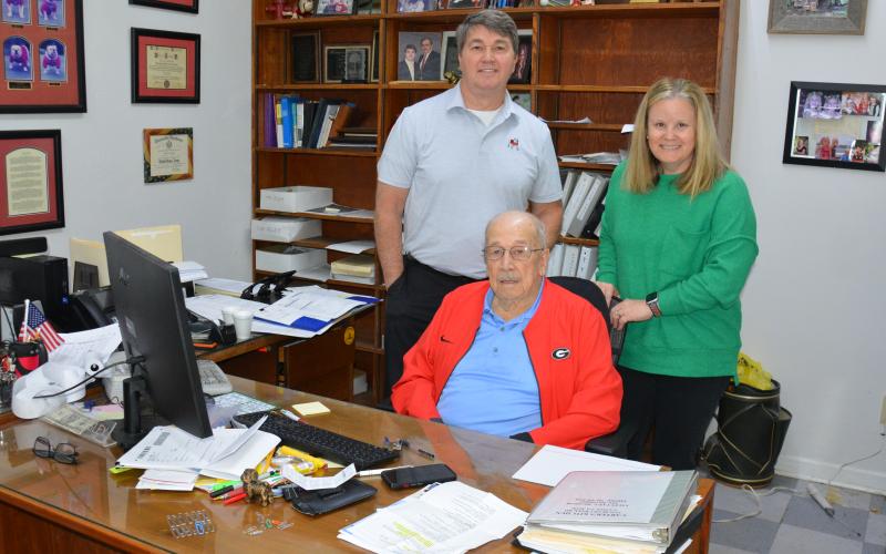 The staff of Beasley Tax and Financial Service, which is celebrating 50 years in business in 2026, includes Tommy Beasley (seated), Rusty Beasley (standing left) and Kelley Schulman. (Photo by Charlie Eavenson)