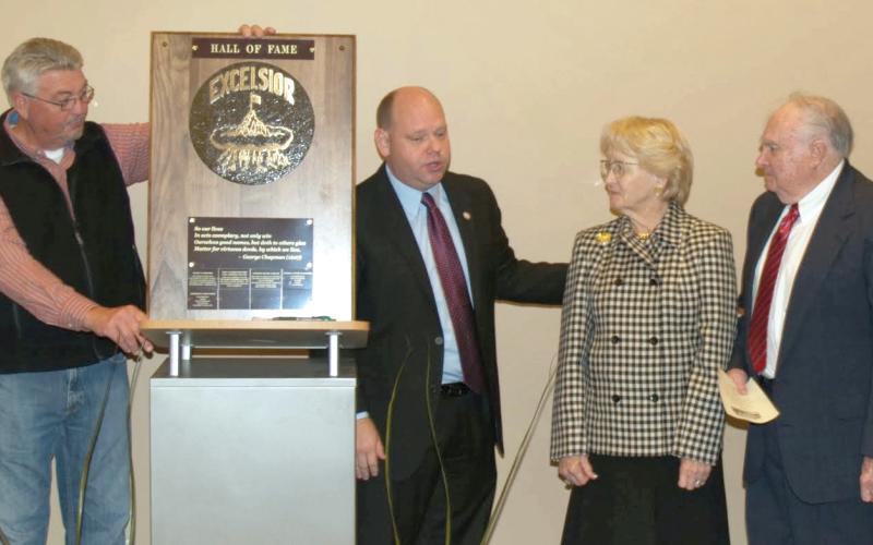 Anderson Dilworth (far right) was presented the City of Royston’s Excelsior Award, the city’s Hall of Fame designation, in 2013, in a ceremony overseen by then-Mayor David Jordan (center). Also pictured are former City Council Member Larry Bowen (left) and Dilworth’s wife, Joel.