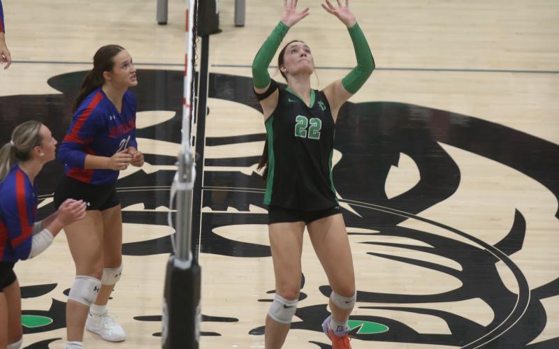 Avery Burton sets the ball Tuesday in action against Jefferson. (Photos by Rose Scoggins)
