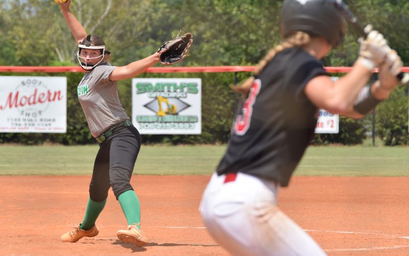 Anna Lunsford delivers a pitch to a Harlem hitter during a game Saturday at Madison County High School in Danielsville. (Photos by Shane Scoggins)