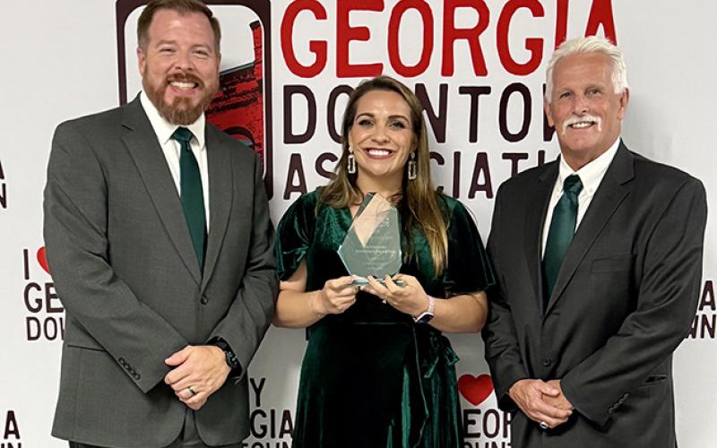 Lavonia Mayor Courtney Umbehant (left), Downtown Development Director Ashley Rose Umbehant (center) and City Manager Robert Ogburn (right) accepted the Outstanding Downtown Promotion Award during the Georgia Downtown Conference in Rome last week. (Photo courtesy of the City of Lavonia)