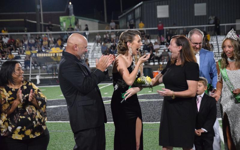 Franklin County High School senior Mia Patterson (above photo, center) reacts Friday after it was announced that she is the 2026 Homecoming Queen for Franklin County High School.