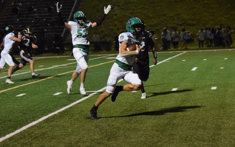 Carson Cheek runs in for one of his five touchdowns Friday against East Hall as teammate Alijah Kibler signals the score. (Photos by Shane Scoggins)