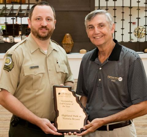 Pictured is Curtis Glass (left) of the DNR and Bill Schuster (right) of Highland Walk.