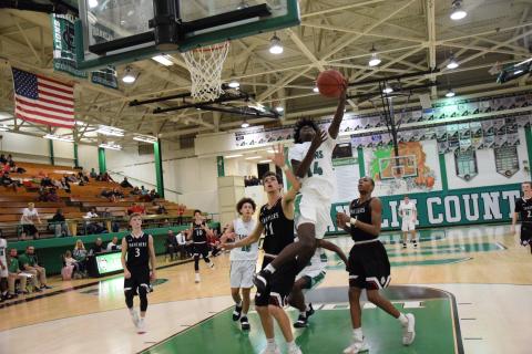 Micah Roebuck takes an acrobatic shot earlier this season against Jackson County.