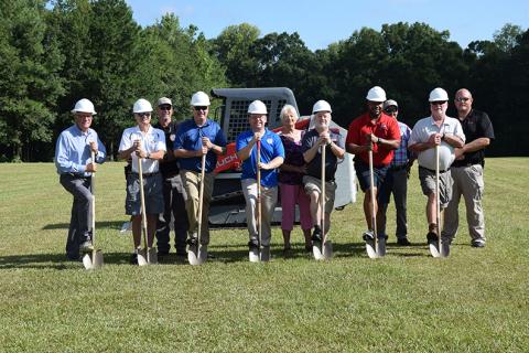 Taking part in a groundbreaking ceremony Tuesday for a new amphitheater at the Royston Wellness and Community Park are (from left) City Manager Ed Andrews,  Council Member Wayne Braswell, Street Superintendent Patrick O’Neal, Council Member Matt Fields, Mayor David Jordan, Shirley Rosenberg of the Downtown Development Authority, Council Member Kenneth Roach, Council Member Keith Turman, Water Superintendent Jammie Cawthon, Council Member Lee Strickland and Police Chief Donnie Bolemon. (Photos by Scoggins)