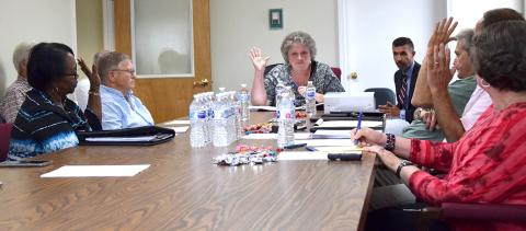 Members of the Franklin County Ethics Board – Joann Butler, Jackie Payne, Chairman Debra Grizzle, Michael O’Connell and Mark Herndon – vote Monday to dismiss a complaint filed by Daniele Weaver against county officials. (Photo by Scoggins)