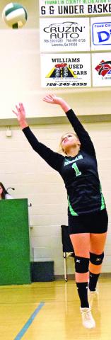 Maci McFarlin sets a ball during action Tuesday against Monroe Area at Rocky Ford Park Gym in Carnesville. (Photo by Scoggins)