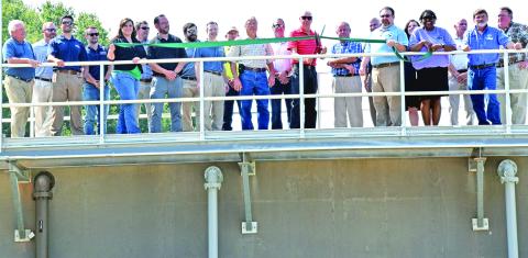 Franklin County and Carnesville city officials were joined by engineers and contractors in a ribbon-cutting ceremony (above) Tuesday at the county’s new wastewater treatment plant in Carnesville. A tour of the plant was held after the ribbon cutting. (Photo by Scoggins)