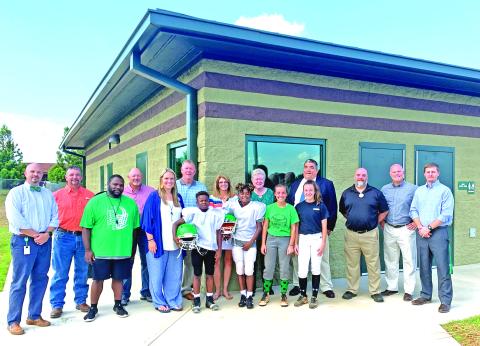 Franklin County Middle School has a new field house. Pictured in front of the new building are FCMS Principal C.J. Wilder, Board of education member Alan Mitchell, FCMS Head Football Coach Jim Allen, BOE member Randall Gailey, FCMS Assistant Principal Kasey Haley, BOE member Eric Burrell, A.J. Elliott, Mylan Roebuck, MacCall Davis, Kenzleigh Fain, BOE member Jo Beth James, BOE member Robin Cato, Franklin County Schools Superintendent Chris Forrer, Assistant Superintendent Chuck Colquitt, Assistant Superinte