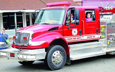 Good equipment (like this engine riding in the Canon Christmas Parade) and training of "a great group of guys" is credited with an improvement in Canon’s ISO rating from a 6 to a 2.