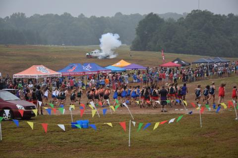 A blast from Franklin County’s touchdown canon sends runners off the start line at the Franklin County Invitational cross-country meet Saturday in Carnesville. (Photo by Scoggins)
