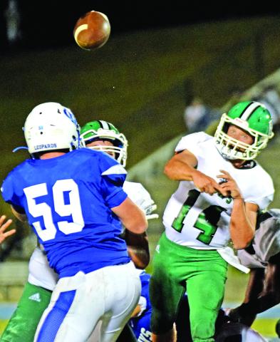 Everett Haselden (above) throws a pass during Friday's game against Banks County in Homer. The junior quarterback finished with 142 yards passing.
