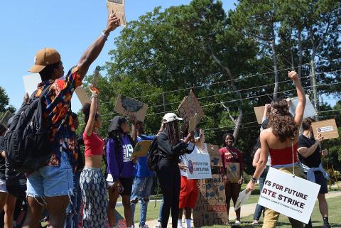 Students and members of the community took part in a Fridays for Future environmental rally Friday at Emmanuel College to bring attention to efforts to clean up the environment and combat climate change. (Photo courtesy of Trinity Duarte)