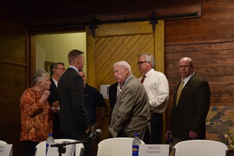 Candidates for Lavonia mayor and city council talk with moderator Bill Hogan (second from right) before Thursday's Lavonia Chamber of Commerce forum at the Lavonia Depot. (Photo by Scoggins)
