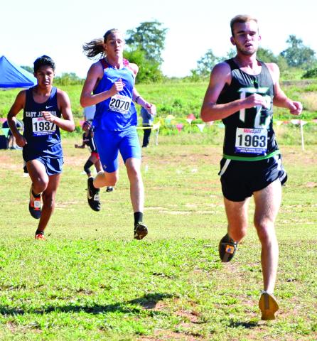 Lion Keaton Burton (right) took fourth-place overall to lead the Franklin County boys’ cross country team to the state meet for the first time in at least 12 years. (Photos by Scoggins)