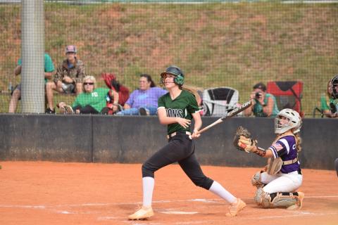 Lady Lion Lauren Hambrick watches a ball she hit during an at-bat Saturday against Monroe Area.