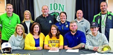 Pictured at Kalyn Jinks’ scholarship signing last week with Reinhardt University are (front, from left) sister Kylie Jinks, mother Vanessa Jinks, Kalyn Jinks, father  Brett Jinks, brother Kayne Jinks, (back) FCHS Basketball Coach John Strickland, Assistant Softball Coach Cherokee Bell, Softball Coach and Athletic Director Jason Oliver, Reinhardt Head Softball Coach Jade Geuther, FCHS Principal Roger Wilkinson and FCHS Tennis Coach Chuck Holland.