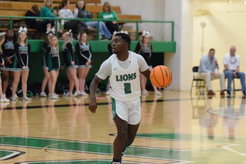 Lion Qua Jones looks for a play against Oglethorpe County Saturday in the Lions Den.