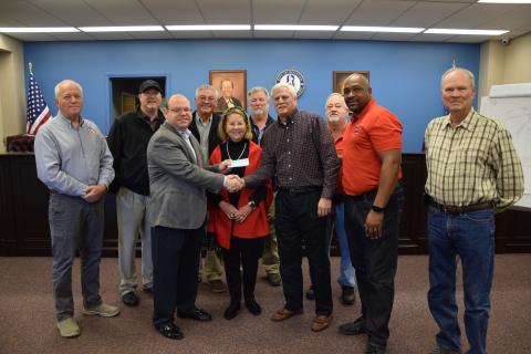 The city of Royston received a donation Thursday from Steve and Robin Williams. Pictured at the presentation of the $50,000 check are (front, from left) Royston Mayor David Jordan, Robin Williams, Steve Williams, Council members Keith Turman and Wayne Braswell, (back) City Manager Ed Andrews, Council members Matt Fields, Larry Bowen, Lee Strickland and Kenneth Roach. The money will be used to continue planning and construction of an amphitheater at the Royston Wellness and Community Park. (Photos by 