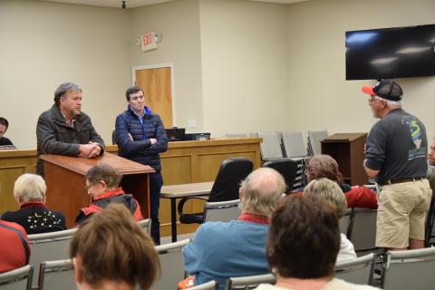 Rodney Black (right), who lives near the Georgia Renewable Power plant near Carnesville, tells GRP officials David Groves (right) and Ciaran McManus (center) about noise and smell problems at the plant during one of many Franklin County Commissioner meetings attended by the plant’s neighbors during the second half of 2019.
