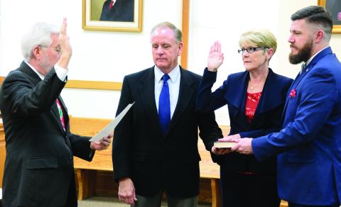 Long-time Franklin County Clerk of Court Missy Holbrook, pictured with husband Greg and son Josh Blakely during her swearing-in ceremony in 2016, has announced she will not seek reelection and will retire.