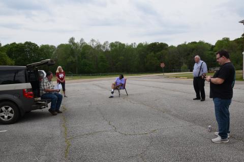 The Carnesville City Council met in the City Hall parking lot Tuesday to accept a federal grant for funding for a splash pad at the city park. (Photo by Scoggins)